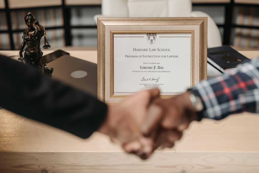 Selective focus photo of a diploma on a frame